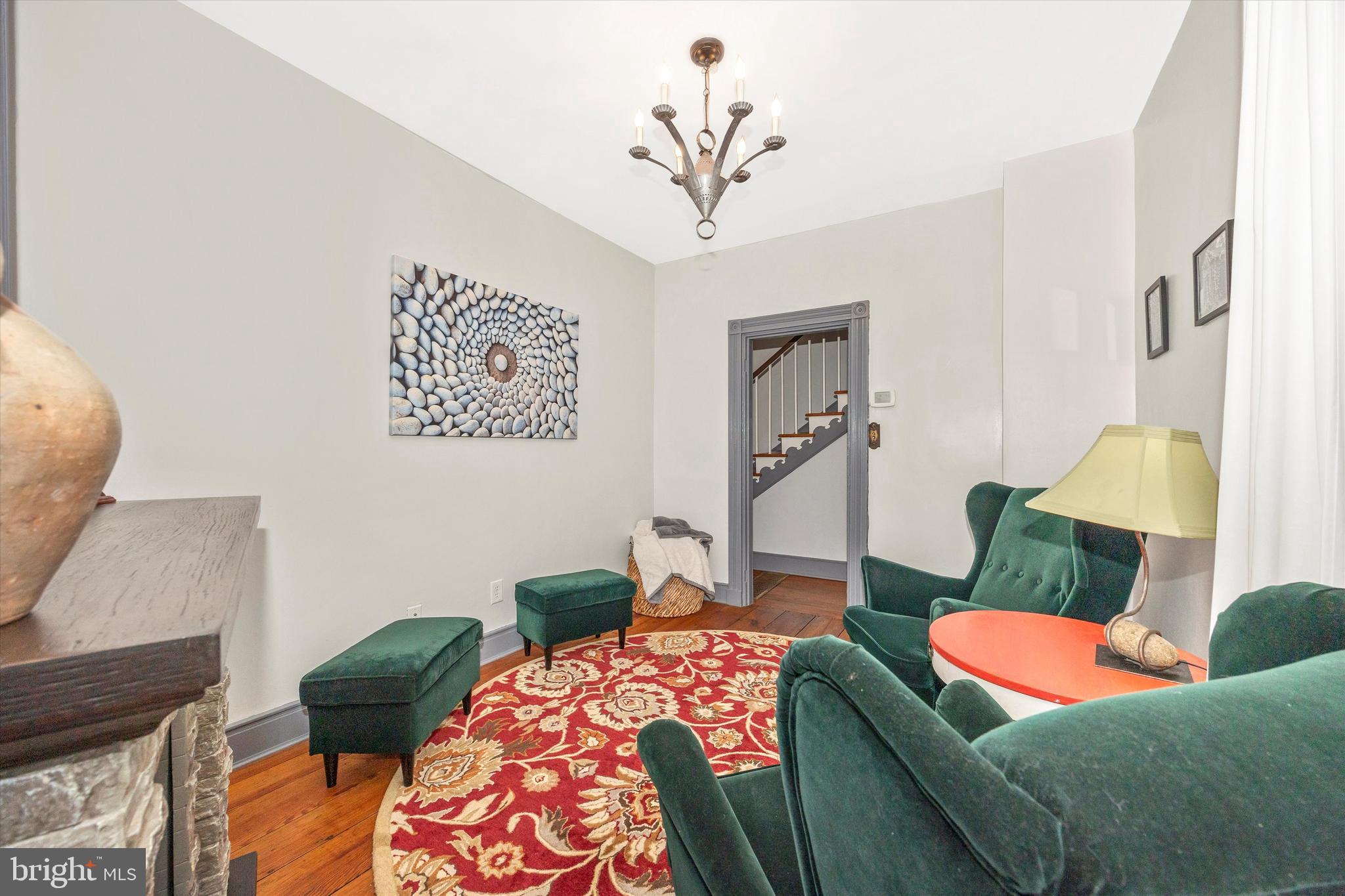 73 West Main Street New Market, MD 21774 - Photo 11 of 44 a living room with furniture and a wooden floor