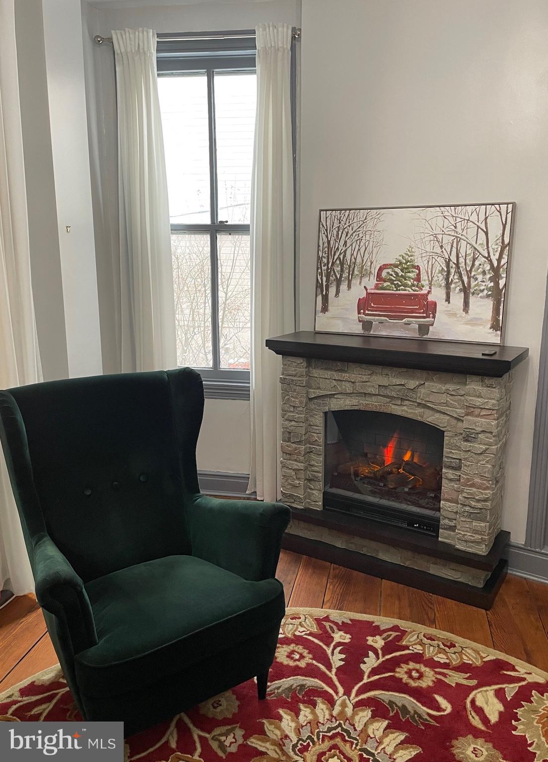 73 West Main Street New Market, MD 21774 - Photo 12 of 44 a living room with furniture and a fireplace