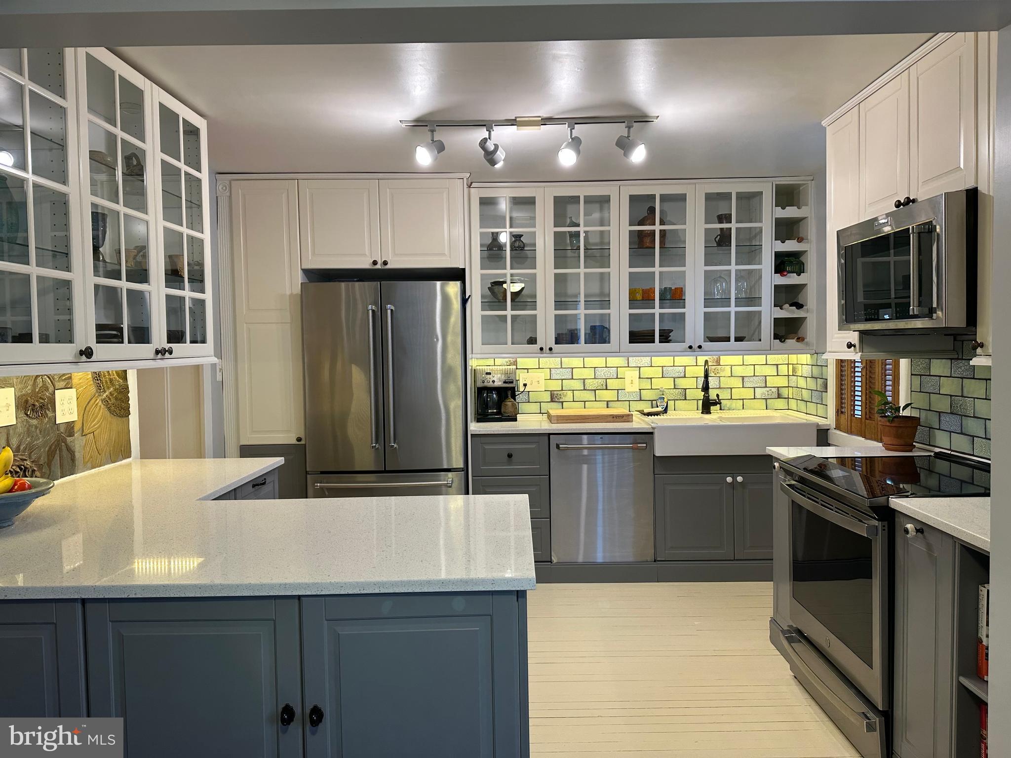 73 West Main Street New Market, MD 21774 - Photo 14 of 44 a kitchen with stainless steel appliances granite countertop a sink and a stove