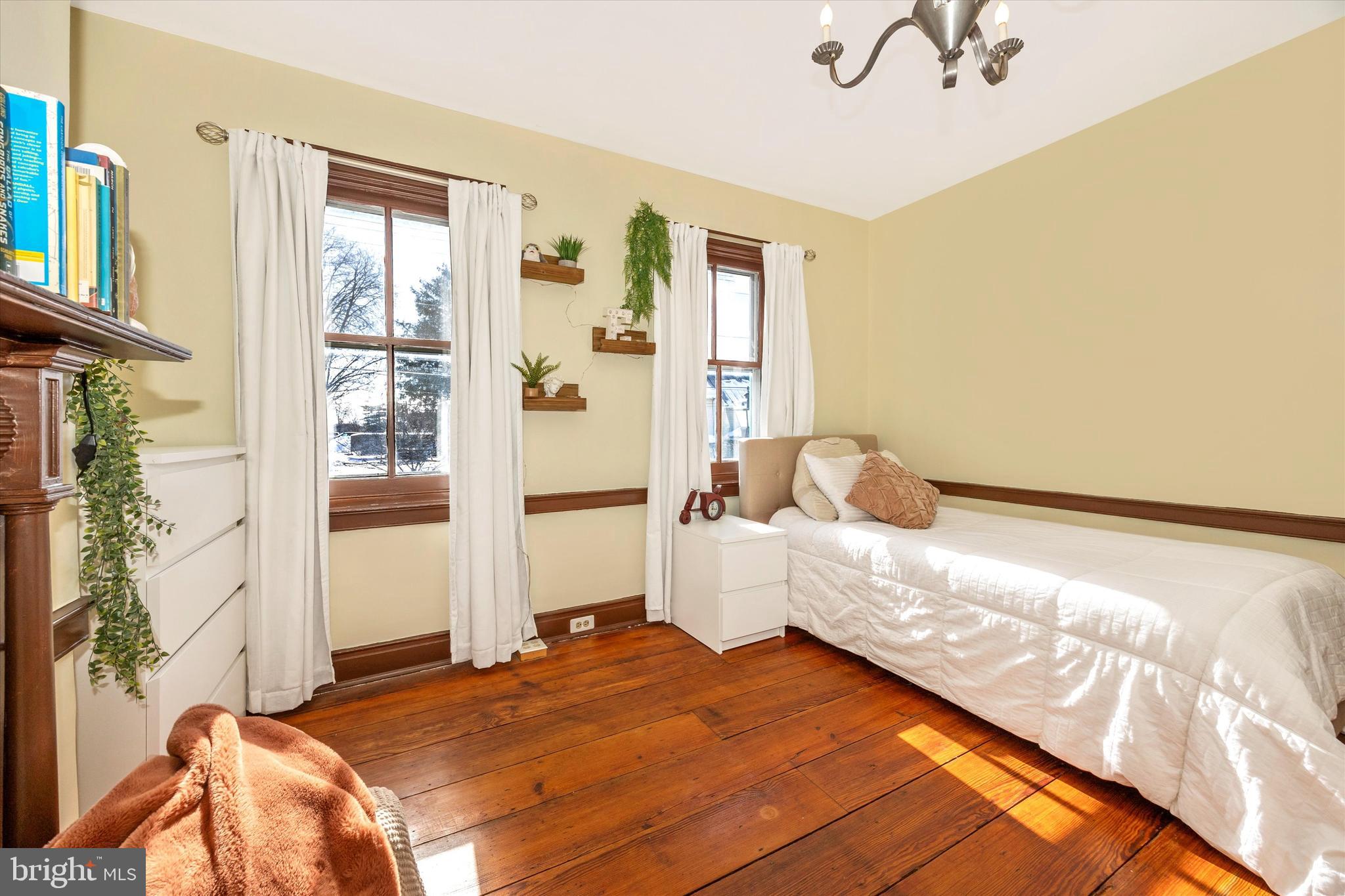 73 West Main Street New Market, MD 21774 - Photo 30 of 44 a bedroom with a bed and a window