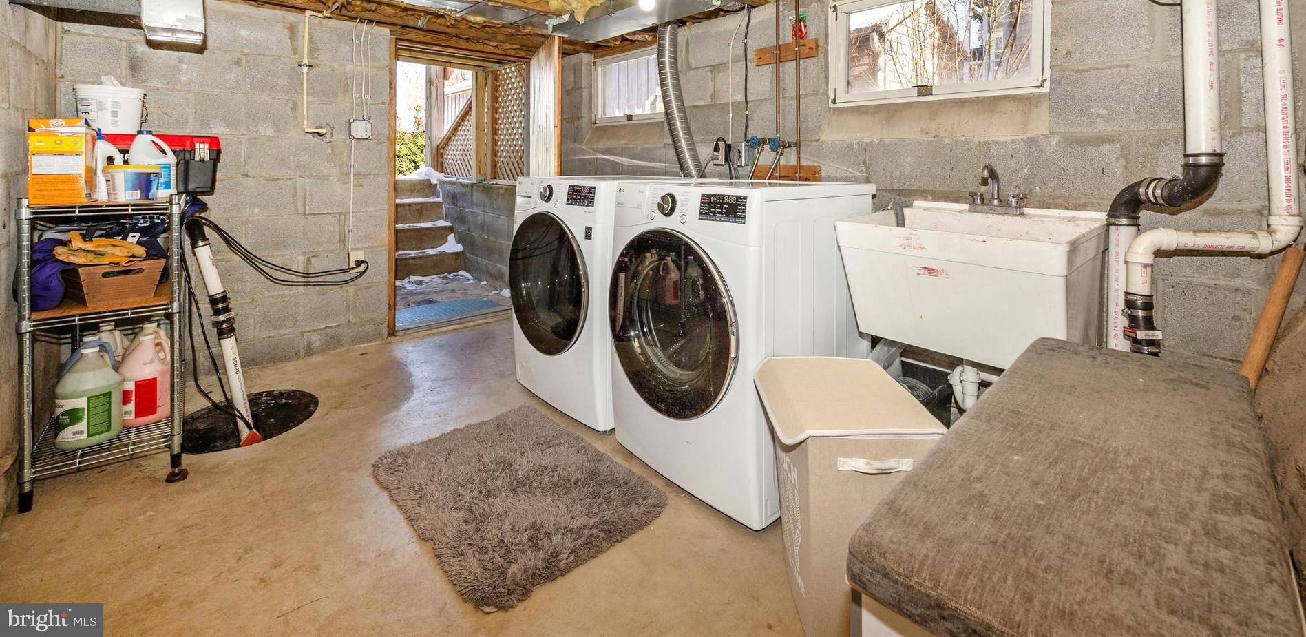 73 West Main Street New Market, MD 21774 - Photo 33 of 44 a utility room with dryer washer and a view of living room