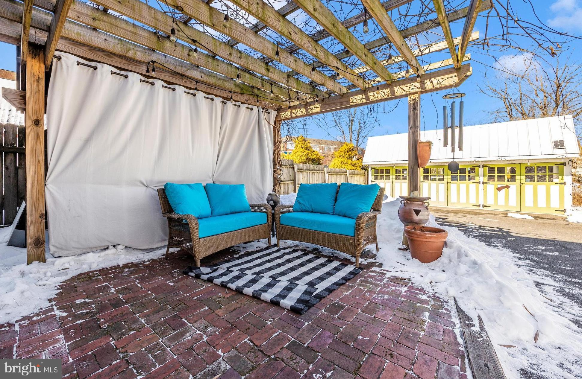 73 West Main Street New Market, MD 21774 - Photo 35 of 44 a blue bench sitting in front of a building