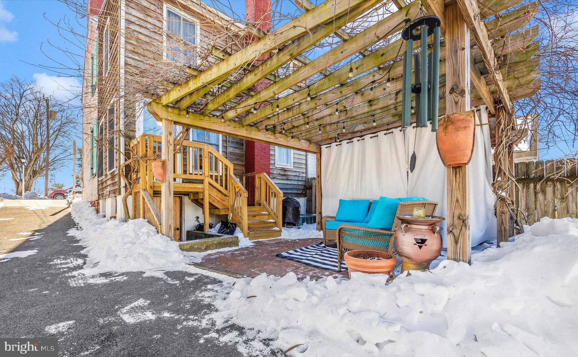 73 West Main Street New Market, MD 21774 - Photo 36 of 44 a wooden bench sitting in front of a building