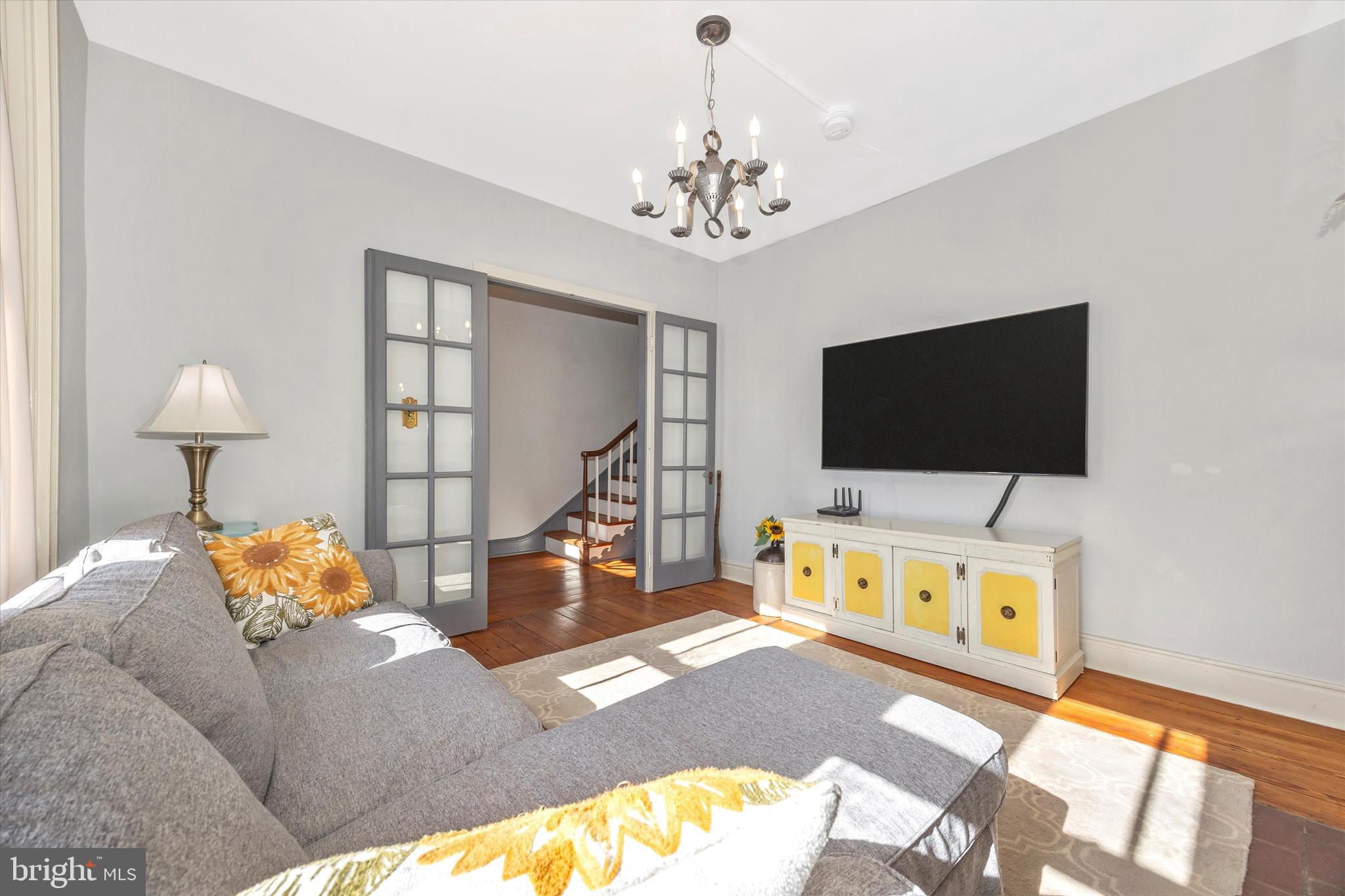 73 West Main Street New Market, MD 21774 - Photo 7 of 44 a living room with furniture and a flat screen tv