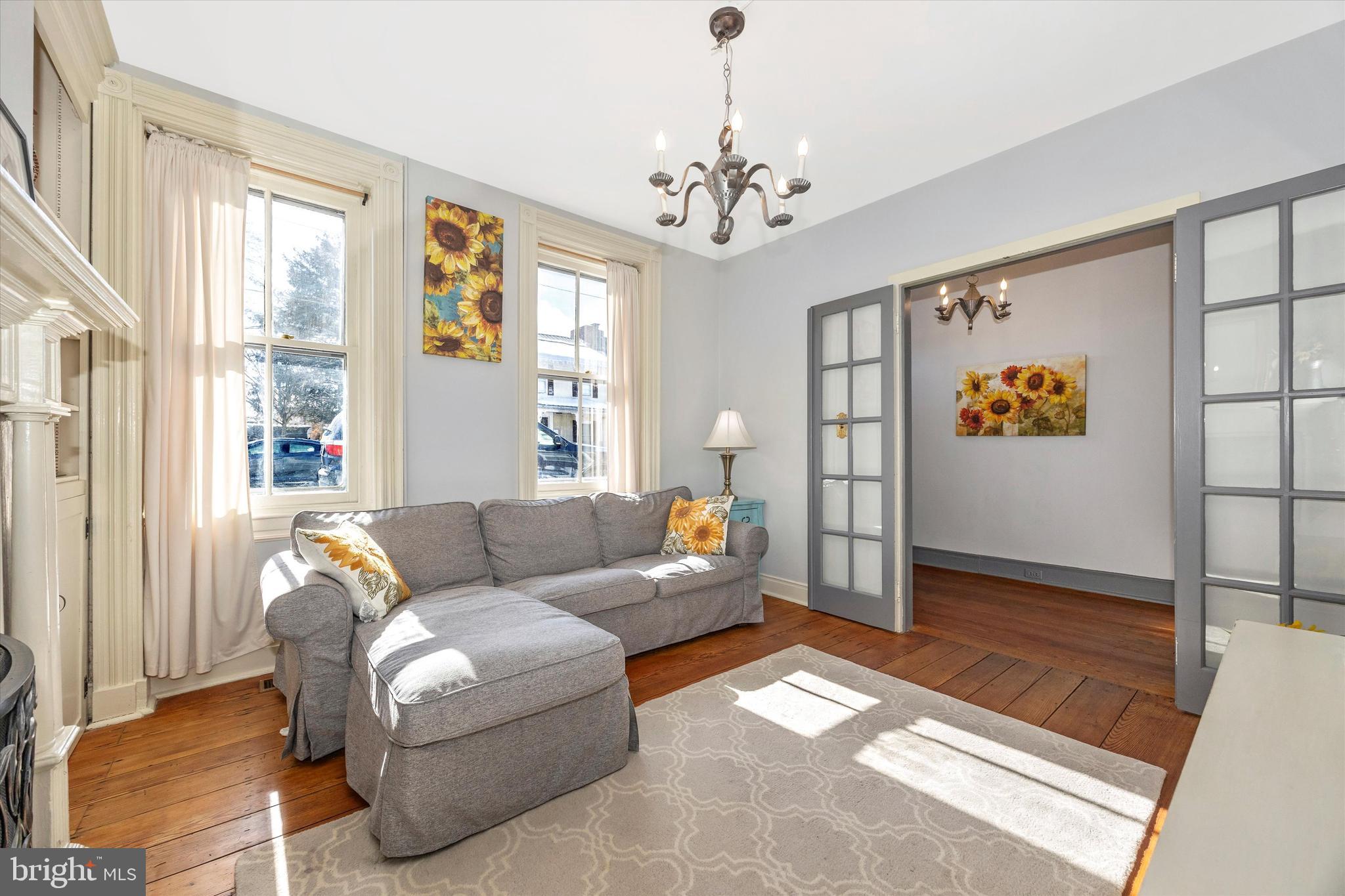 73 West Main Street New Market, MD 21774 - Photo 8 of 44 a living room with furniture and a chandelier