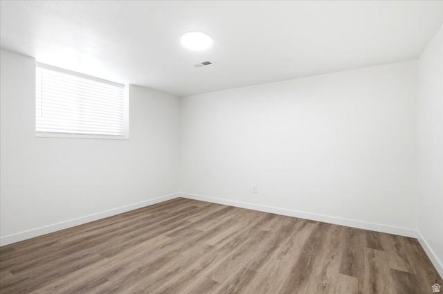 1676 East 11245 South Sandy, UT 84092 - Photo 25 of 34 Bright room featuring wood-finish flooring and a white color palette