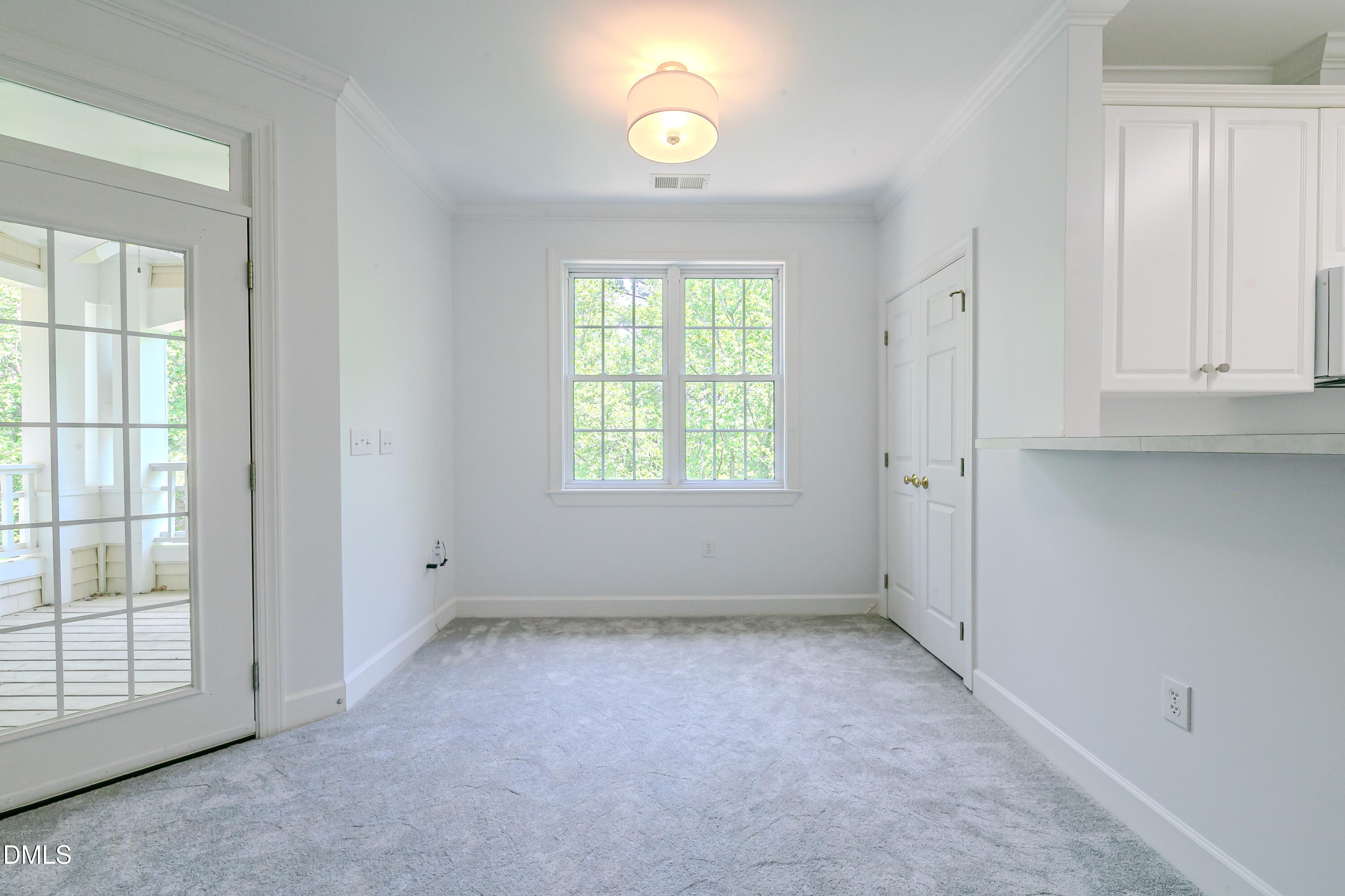 116 Northbrook Drive, Unit 305 Raleigh, NC 27609 - Photo 23 of 43 an empty room with windows