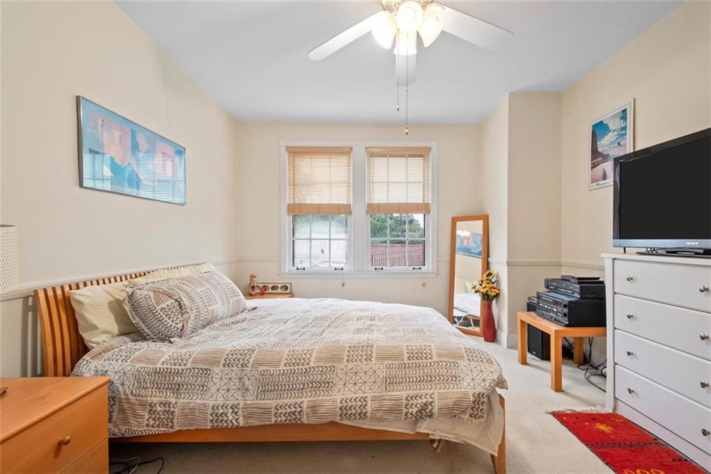 5624 Marlborough Road Pittsburgh, PA 15217 - Photo 13 of 25 a bedroom with a bed and flat screen tv