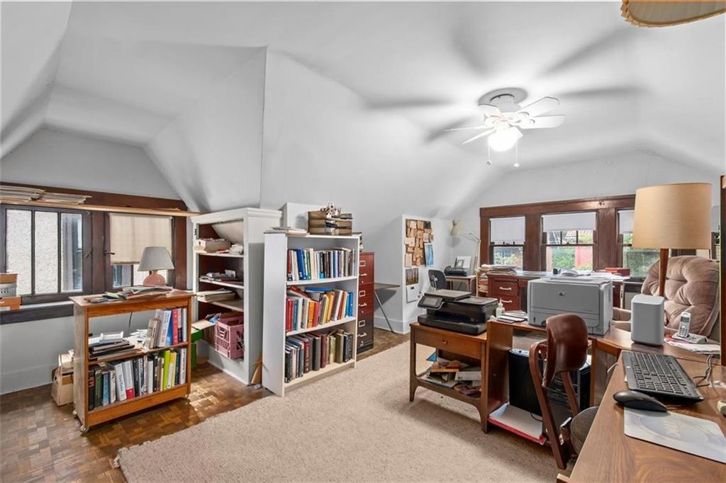 5624 Marlborough Road Pittsburgh, PA 15217 - Photo 18 of 25 a living room with furniture a flat screen tv and a book shelf