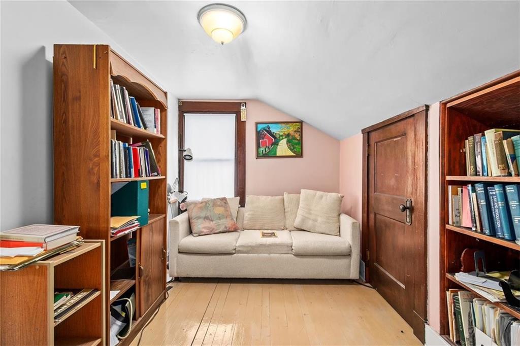 5624 Marlborough Road Pittsburgh, PA 15217 - Photo 19 of 25 a living room with furniture and a book shelf