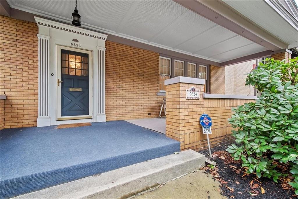 5624 Marlborough Road Pittsburgh, PA 15217 - Photo 4 of 25 a front view of a house with a garden