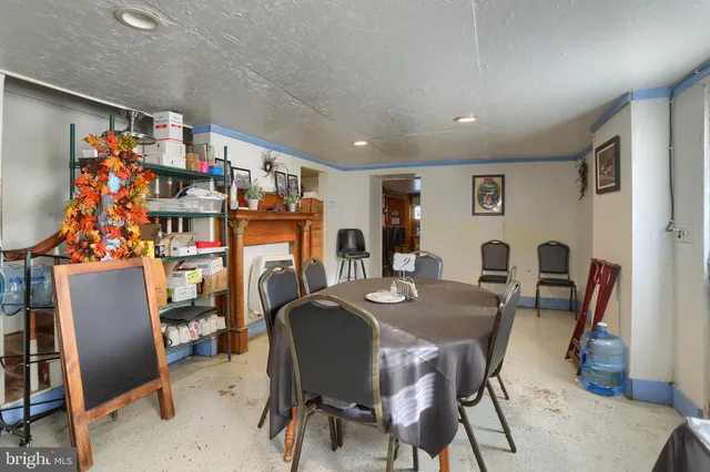 a bathroom with a toilet a sink and a window
