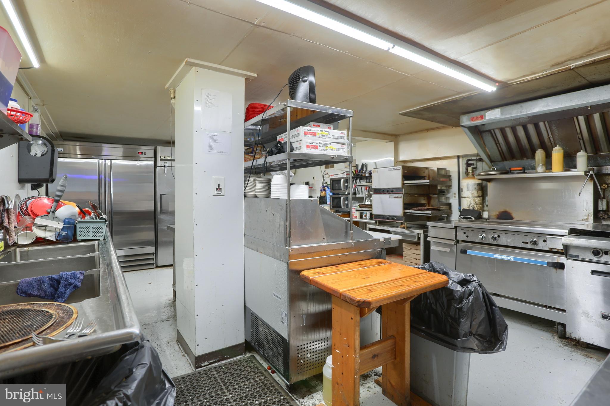 3095 Turkey Valley Road Mount Pleasant Mills, PA 17853 - Photo 27 of 55 a kitchen with stainless steel appliances granite countertop a stove refrigerator and a sink