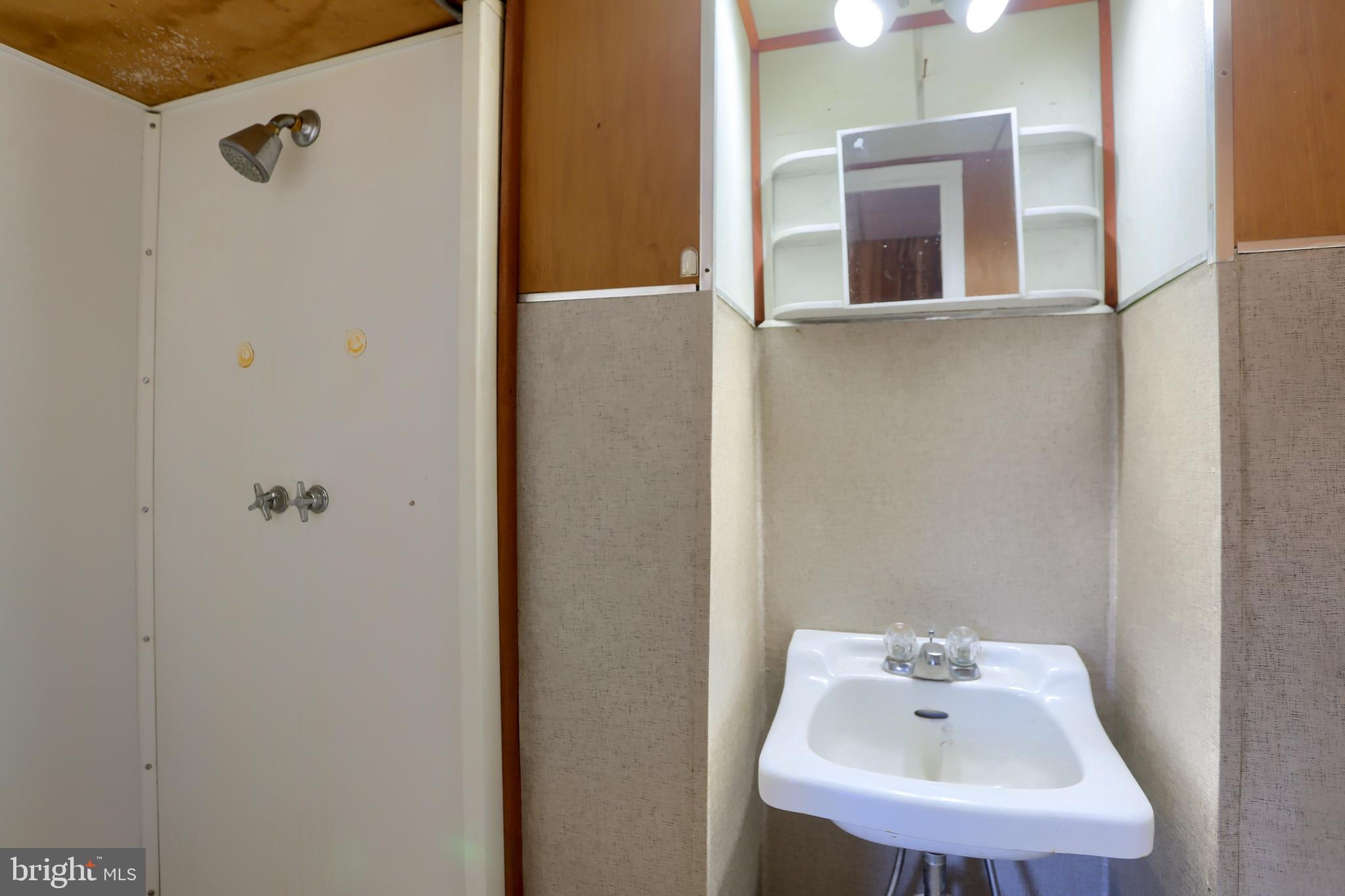 3095 Turkey Valley Road Mount Pleasant Mills, PA 17853 - Photo 38 of 55 a bathroom with a sink and mirror