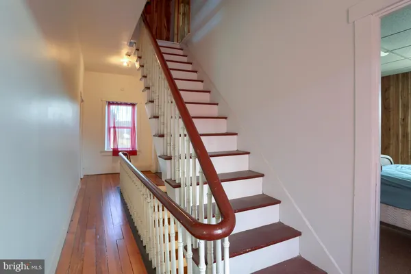 a view of entryway with wooden floor