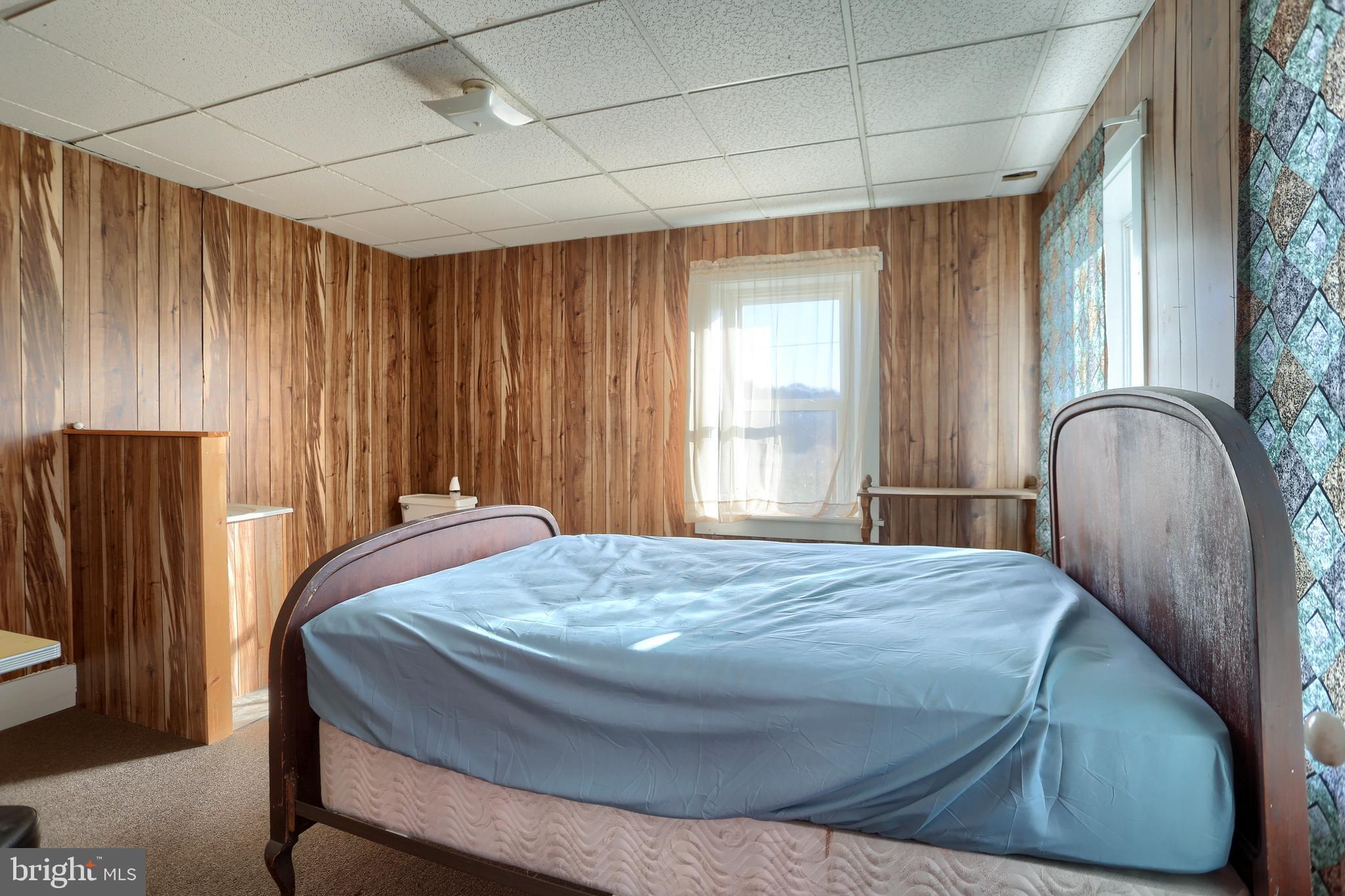 3095 Turkey Valley Road Mount Pleasant Mills, PA 17853 - Photo 43 of 55 a bed sitting in a spacious bedroom next to a window