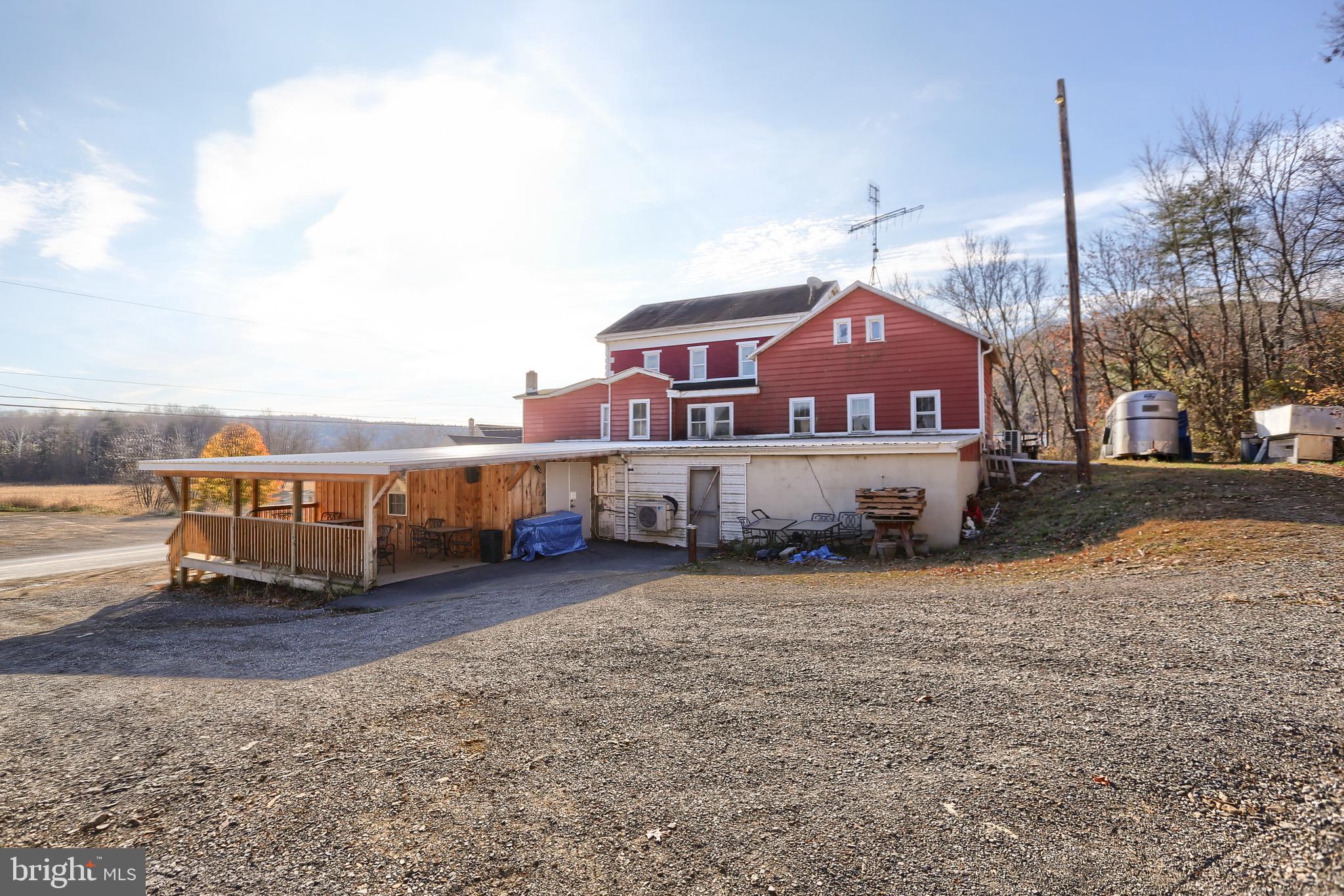 3095 Turkey Valley Road Mount Pleasant Mills, PA 17853 - Photo 50 of 55 a view of a house with a yard and sitting area