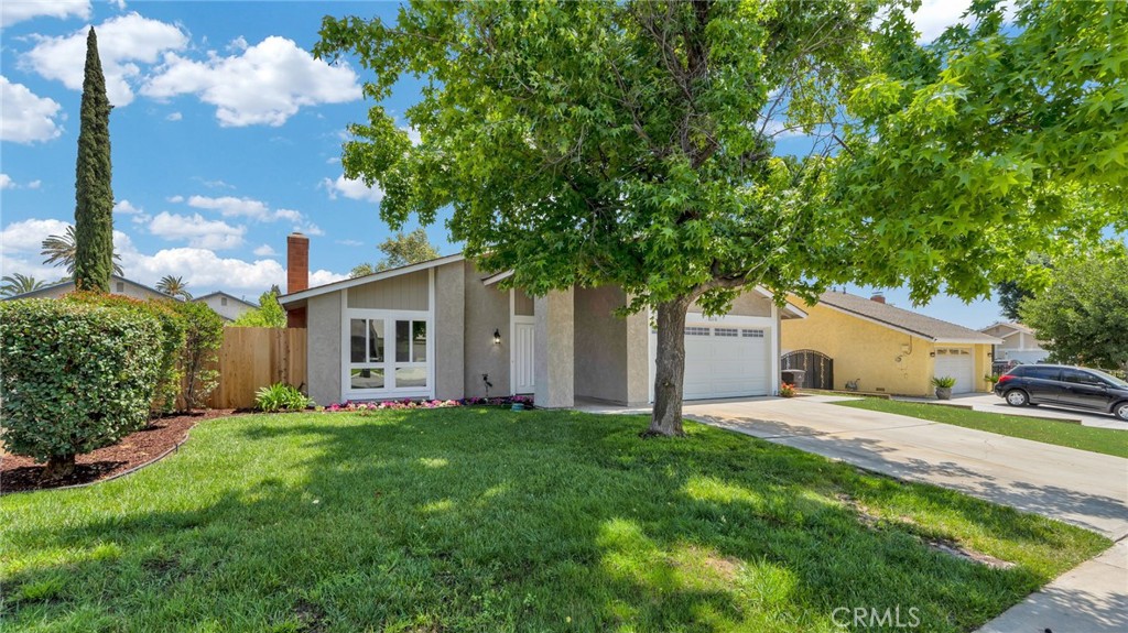 8310 Baxter Way Riverside, CA 92504 - Photo 1 of 1 a house view with a sitting space and garden