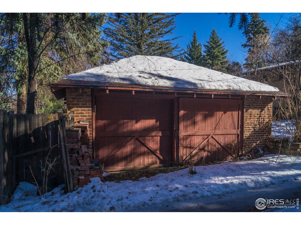 757 12th Street Boulder, CO 80302 - Photo 4 of 7 a backyard of a house with wooden fence