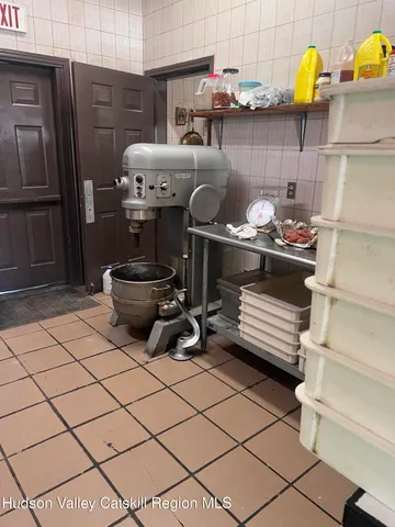 a kitchen with a stove and a refrigerator