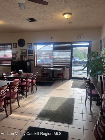 a living room with furniture a large window
