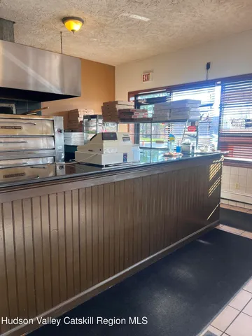 a kitchen with counter top space cabinets and outdoor space