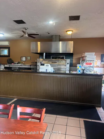 a kitchen with stainless steel appliances granite countertop a sink counter space and cabinets