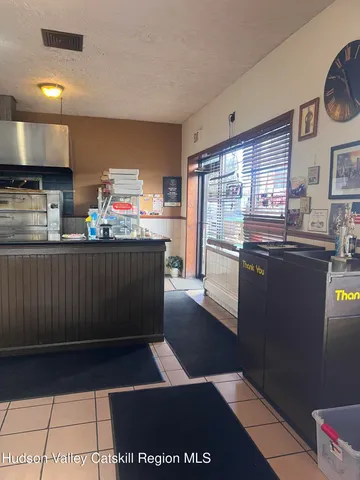 a kitchen with stainless steel appliances a sink stove and refrigerator