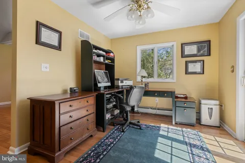 a bedroom with furniture and a window