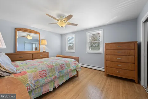 a bedroom with a bed and a dresser
