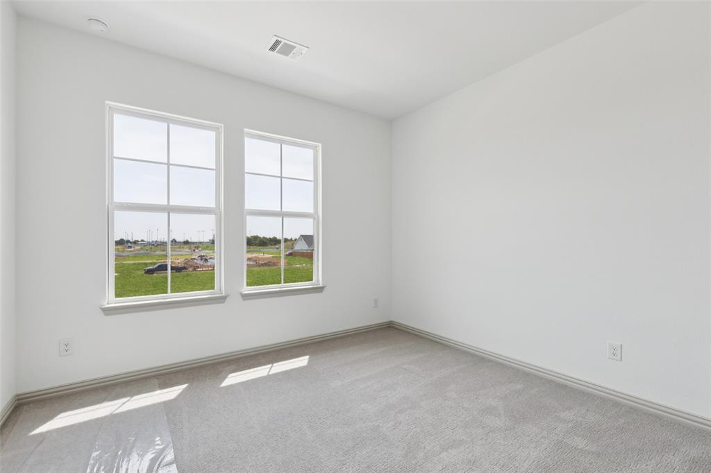 1029 Magdalena Way Midlothian, TX 76065 - Photo 16 of 16 You'll find a nicely sized secondary bedroom in our Boyd floor plan.