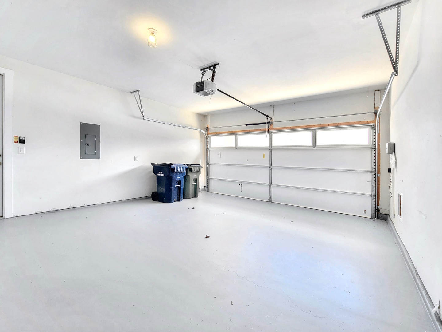 2329 Gabriels Horn Road Leander, TX 78641 - Photo 21 of 23 A pristine garage with a smooth, light-colored floor, ready for vehicles or projects.