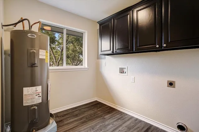 a view of closet with wooden floor