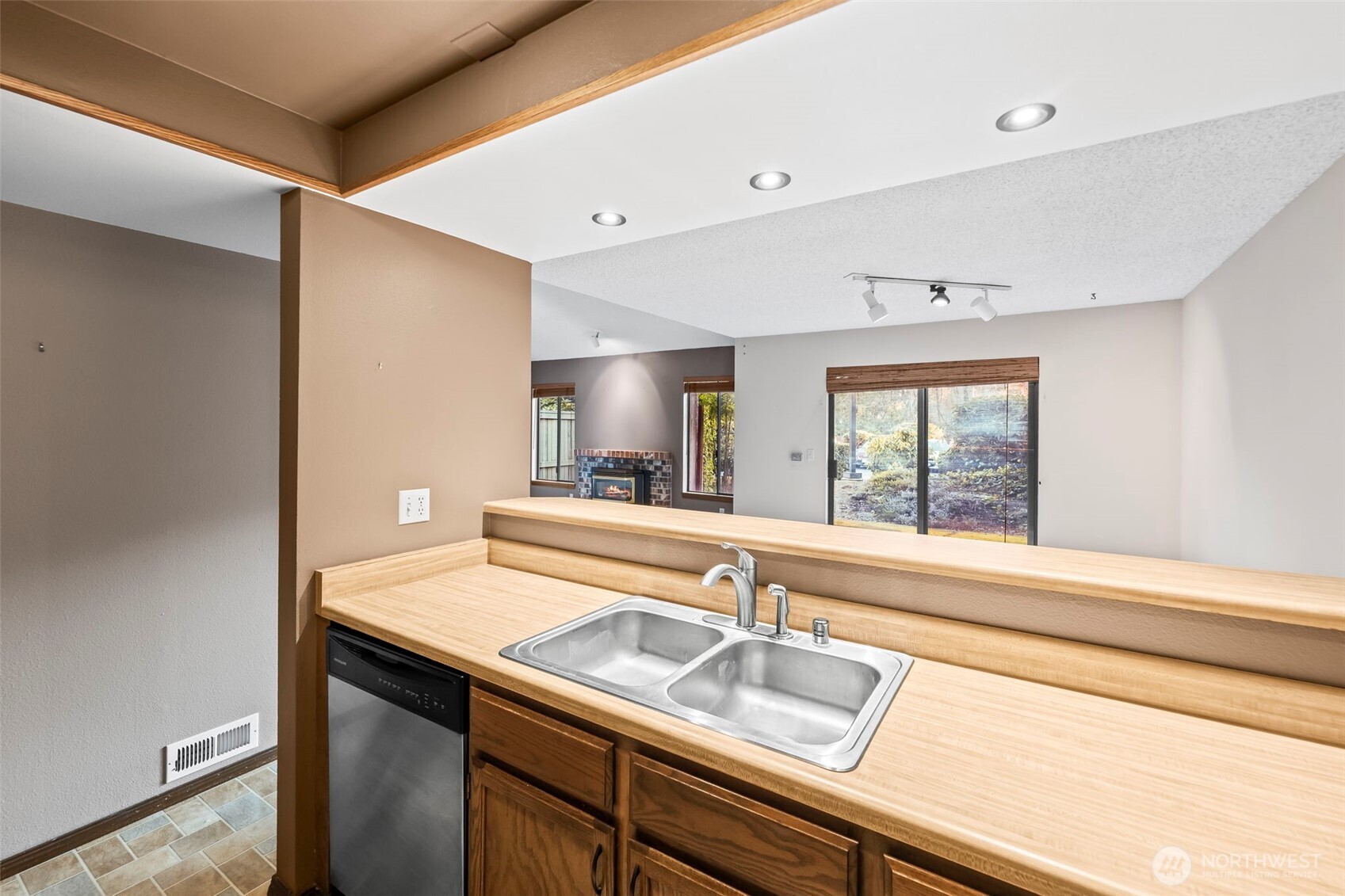 31727 47th Lane Southwest, Unit C Federal Way, WA 98023 - Photo 12 of 39 a white kitchen with sink and window
