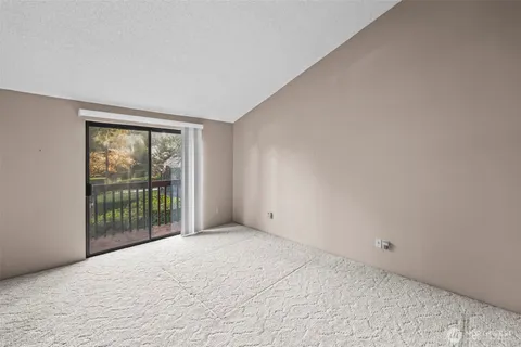 a view of an empty room with a balcony