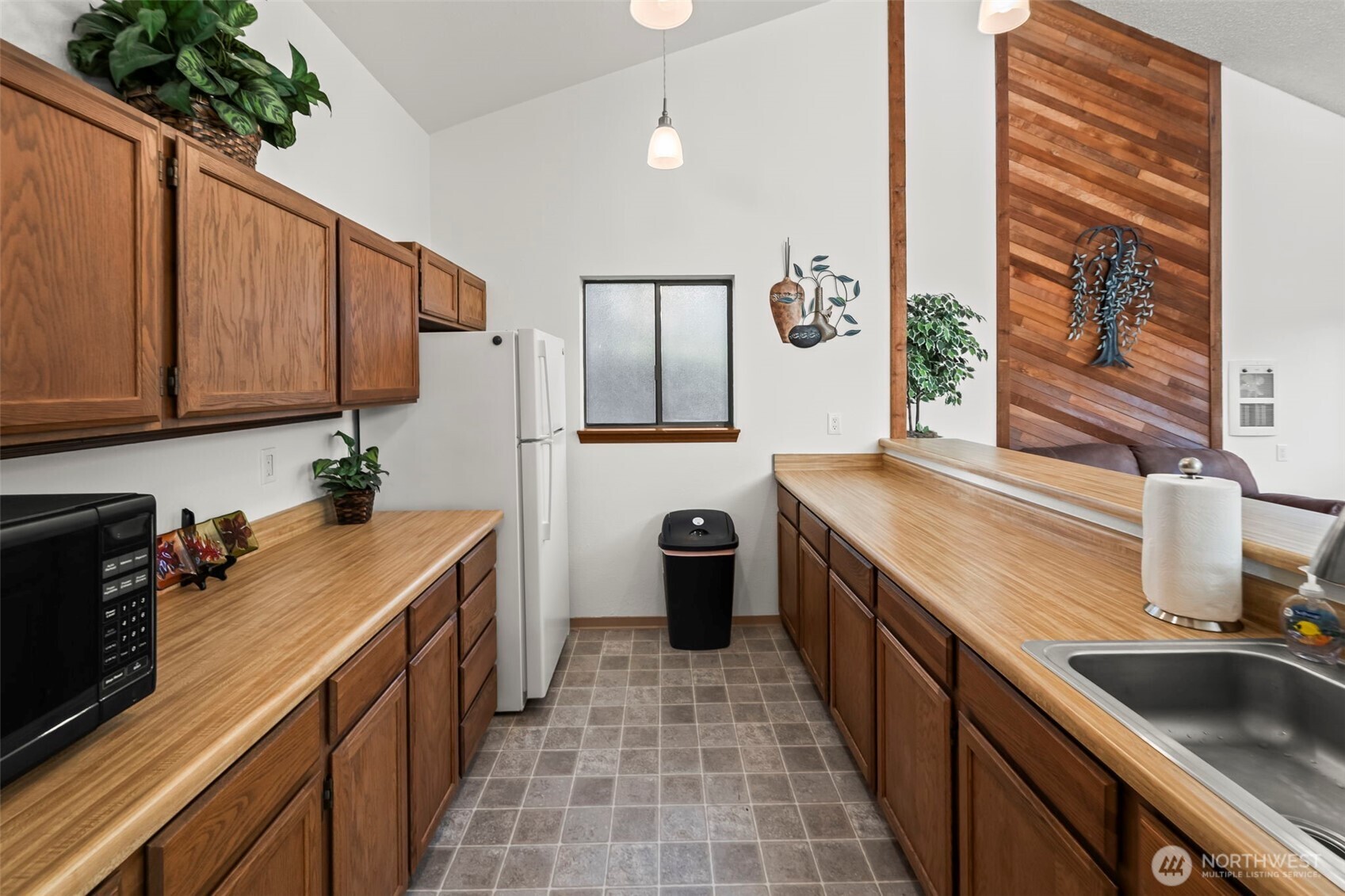 31727 47th Lane Southwest, Unit C Federal Way, WA 98023 - Photo 28 of 39 a kitchen with a sink stove and cabinets