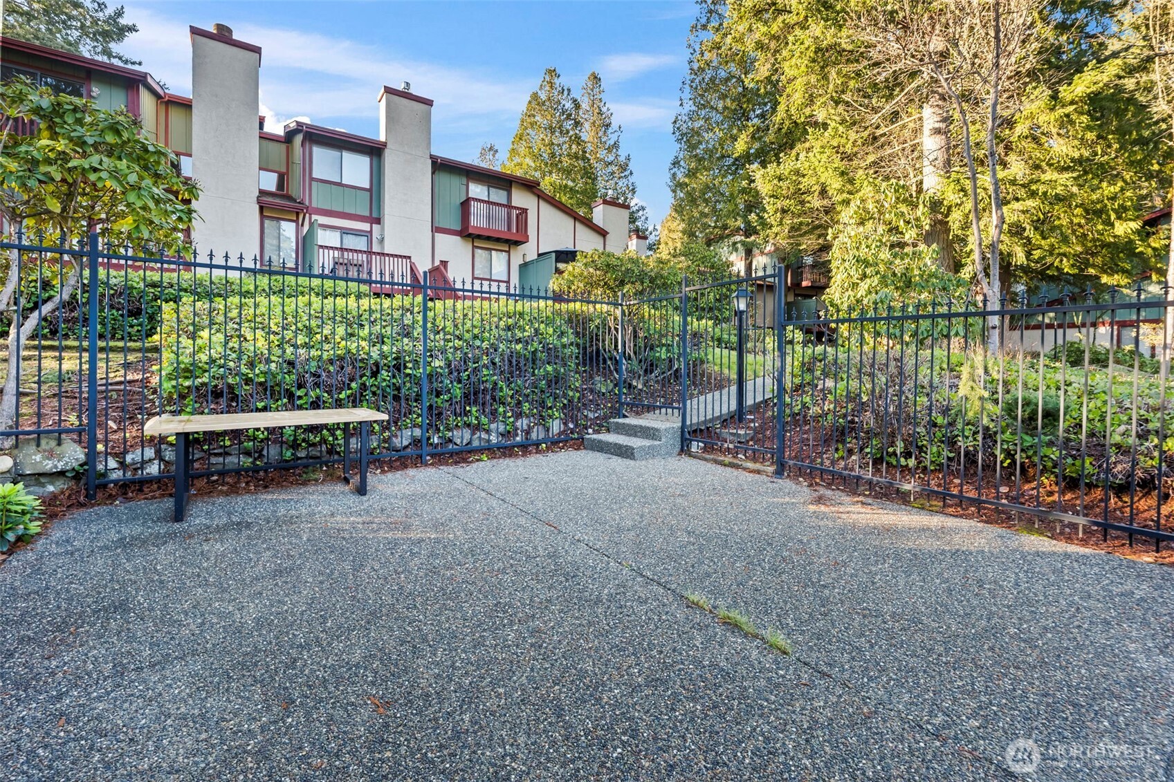 31727 47th Lane Southwest, Unit C Federal Way, WA 98023 - Photo 36 of 39 a view of a bench in a garden