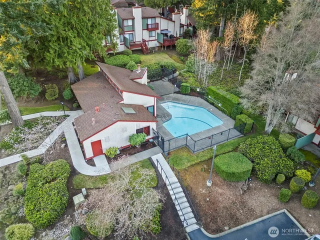 an aerial view of a house with outdoor space