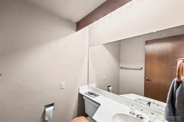 a bathroom with a toilet and a sink