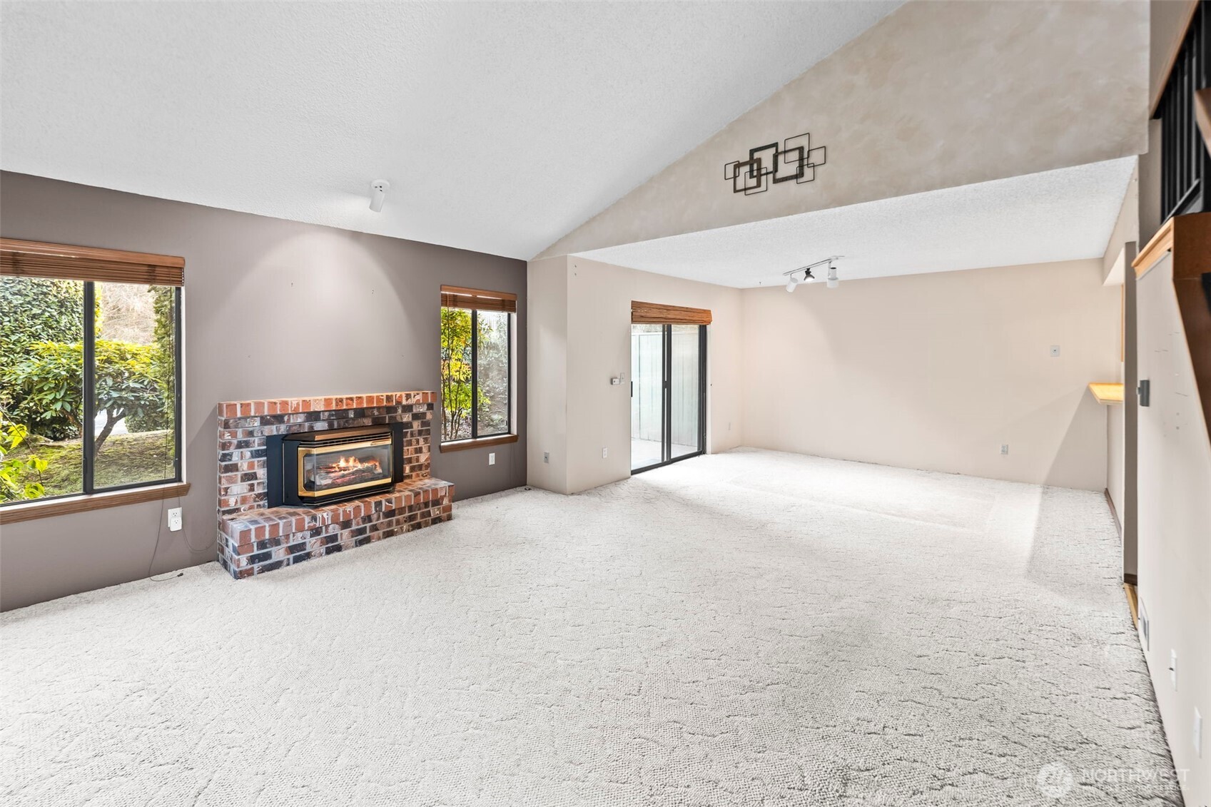 31727 47th Lane Southwest, Unit C Federal Way, WA 98023 - Photo 7 of 39 a view of an empty room with a fireplace and a window
