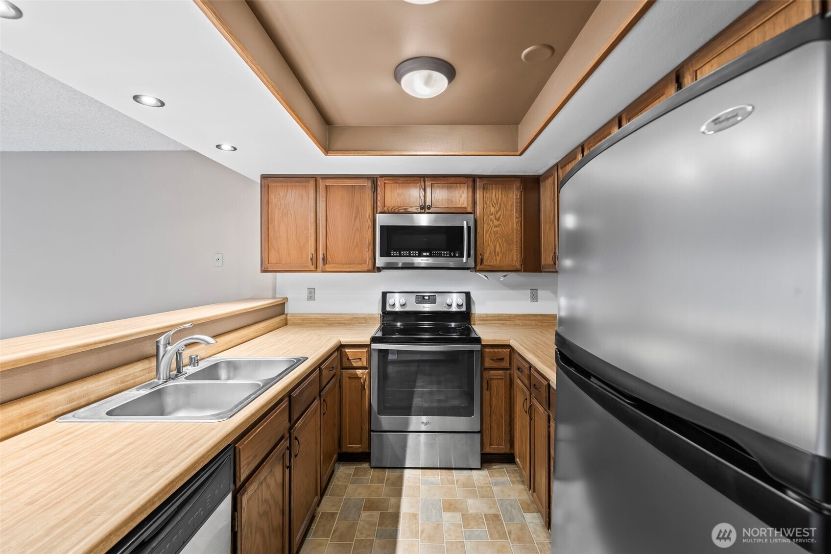 31727 47th Lane Southwest, Unit C Federal Way, WA 98023 - Photo 10 of 39 a kitchen with a sink stainless steel appliances and cabinets