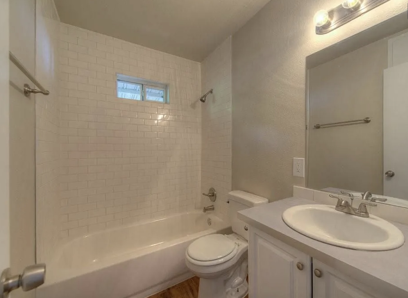 1124 Gardner Road, Unit B Austin, TX 78721 - Photo 13 of 15 Full bath with a textured wall, vanity, and bathing tub / shower combination