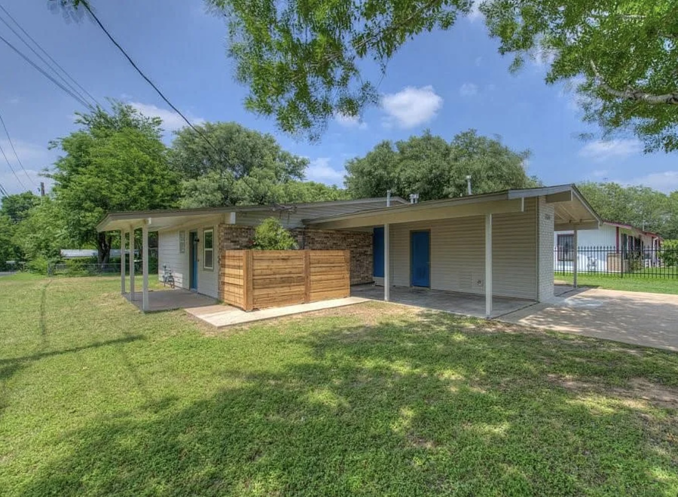 1124 Gardner Road, Unit B Austin, TX 78721 - Photo 2 of 15 Rear view of property featuring a patio and a carport