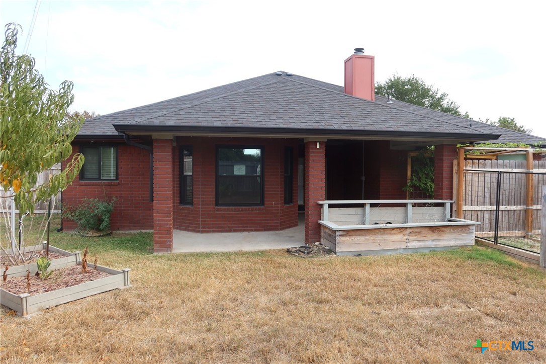 5101 Spring Drive Killeen, TX 76542 - Photo 2 of 11 a front view of a house with a yard