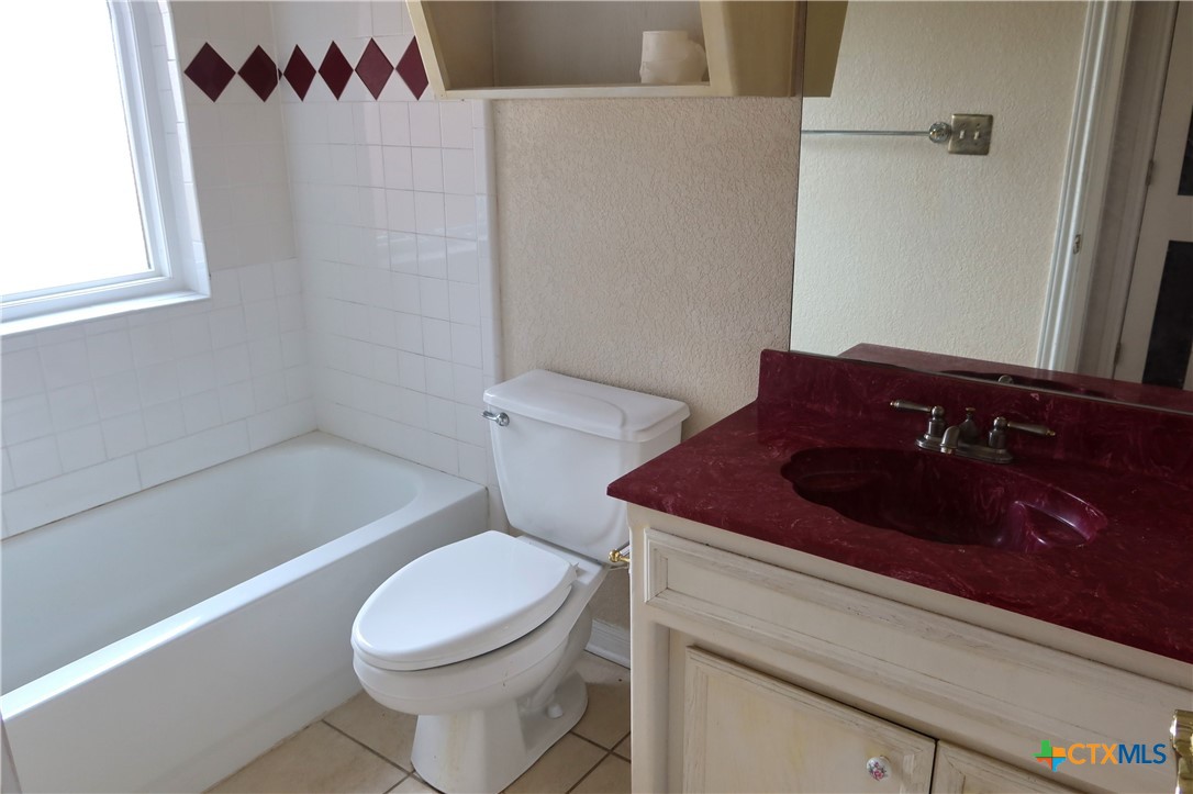 5101 Spring Drive Killeen, TX 76542 - Photo 8 of 11 a bathroom with a toilet and a sink
