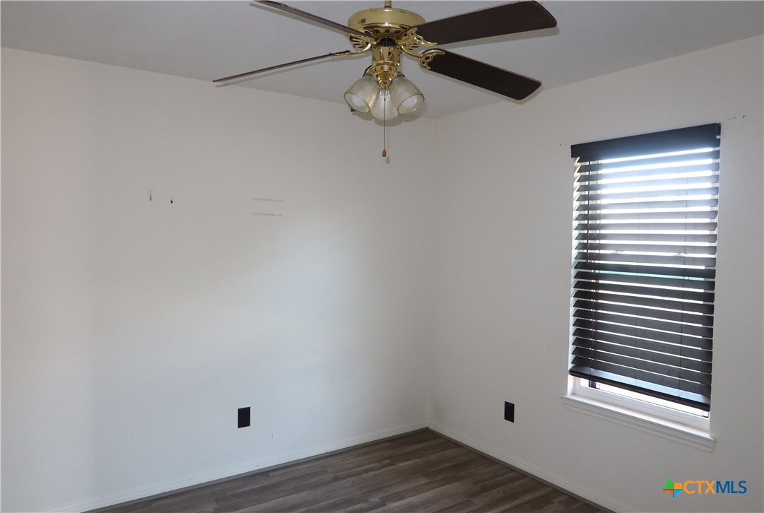 5101 Spring Drive Killeen, TX 76542 - Photo 10 of 11 a view of a room with a window and wooden floor