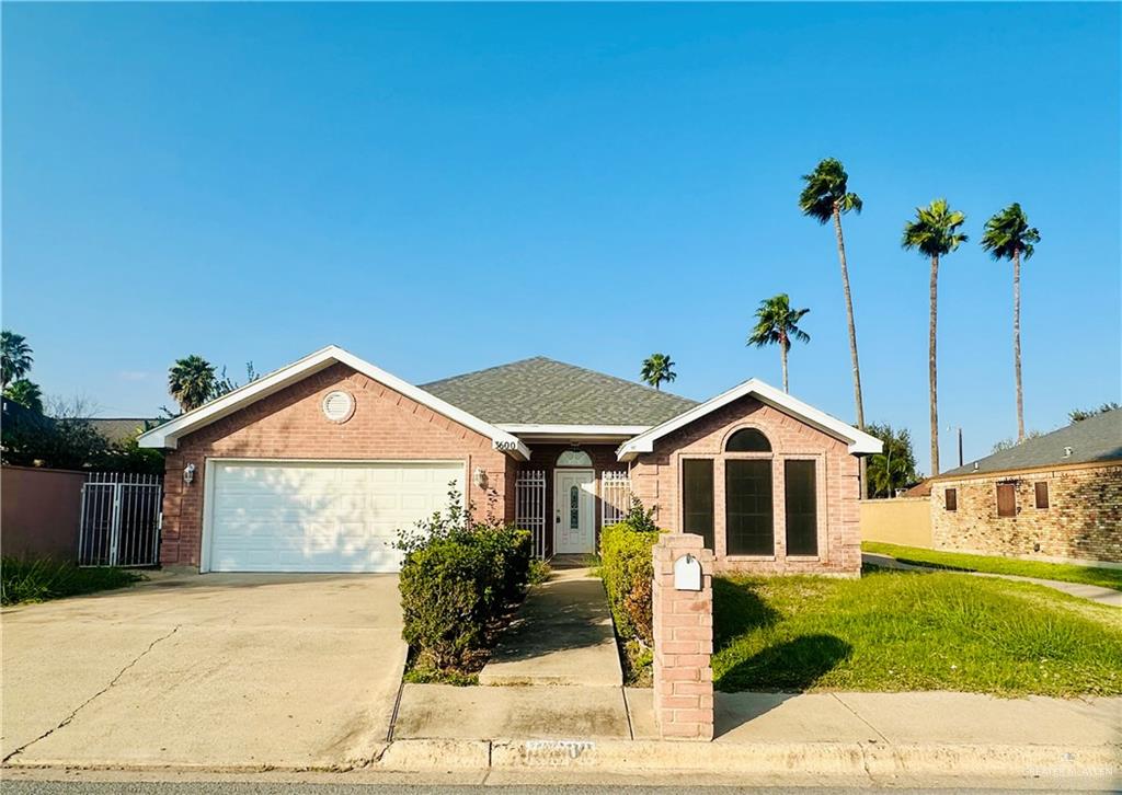 3600 Cedar Avenue McAllen, TX 78501 - Photo 1 of 17 a front view of a house with garden
