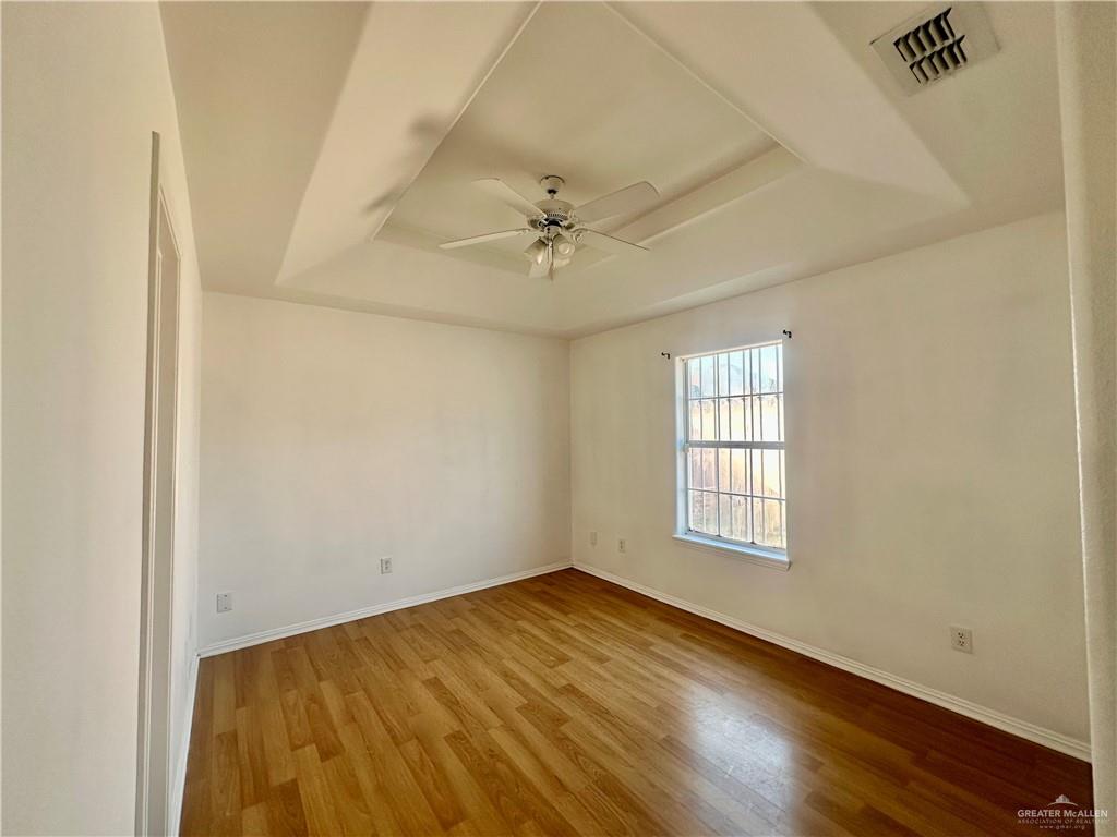 3600 Cedar Avenue McAllen, TX 78501 - Photo 12 of 17 an empty room with windows and fan