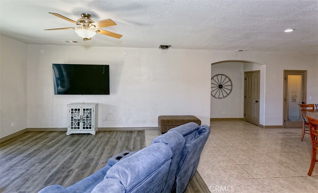 8855 Smith Road Phelan, CA 92371 - Photo 17 of 43 a living room with furniture and a flat screen tv