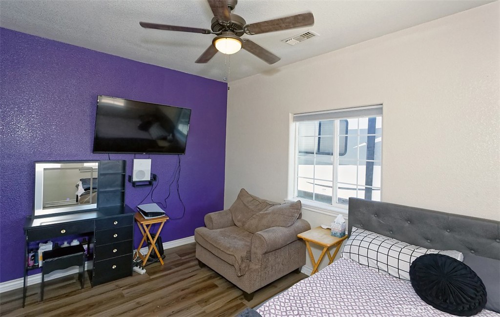 8855 Smith Road Phelan, CA 92371 - Photo 24 of 43 a living room with furniture and a flat screen tv